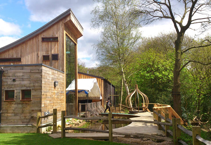 Stone and wood buildings at the J.G. Graves Woodland Discovery Centre.