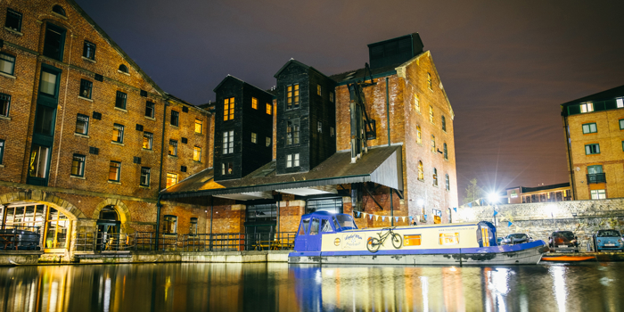 Victoria Quays lit up at night.