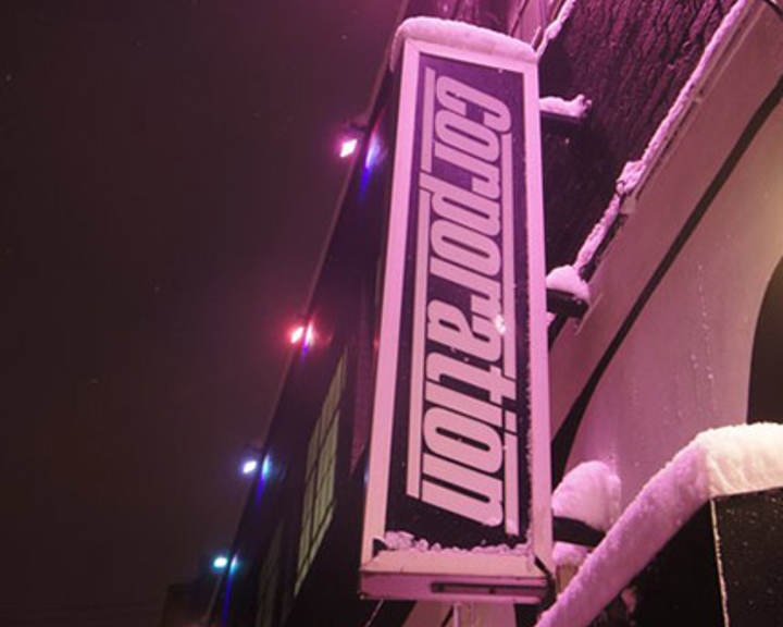 The Corporation sign on the side of the building.
