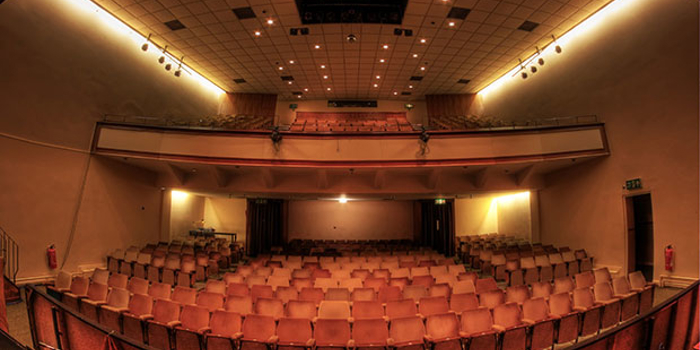 A view of the Montgomery theatre, from the back, looking across the seating, towards the stage.