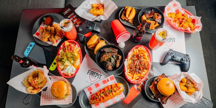 A table full of American style food at FirePit Rocks Bar and BBQ.