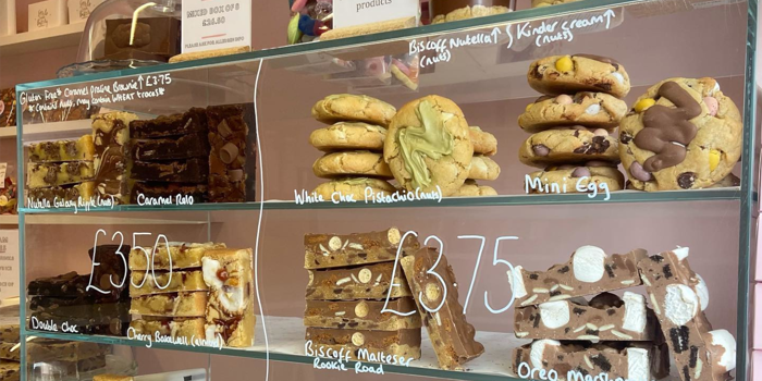 A glass cabinet full of cookies, brownies and other treats at Sorrel's Cocoa Bakery