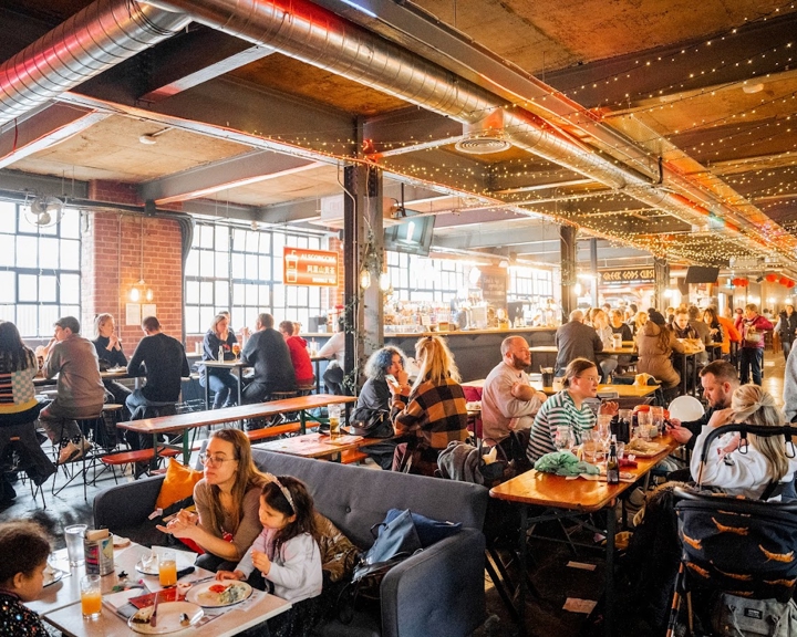 Inside Cutlery Works, filled with customers dining.