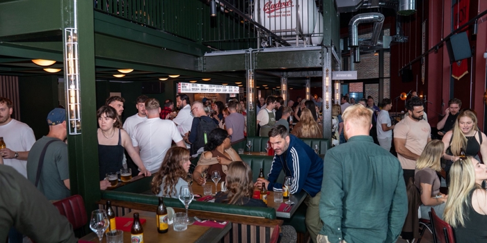 Lots of people socializing at the opening of Kapital Sheffield beer hall 