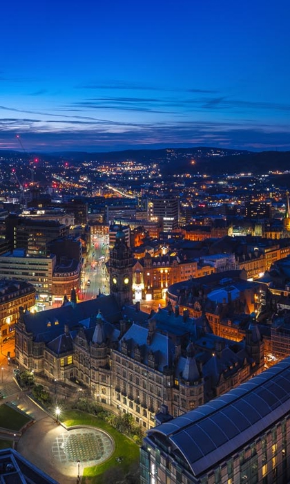 A panorama shot of the Sheffield skyline at night.
